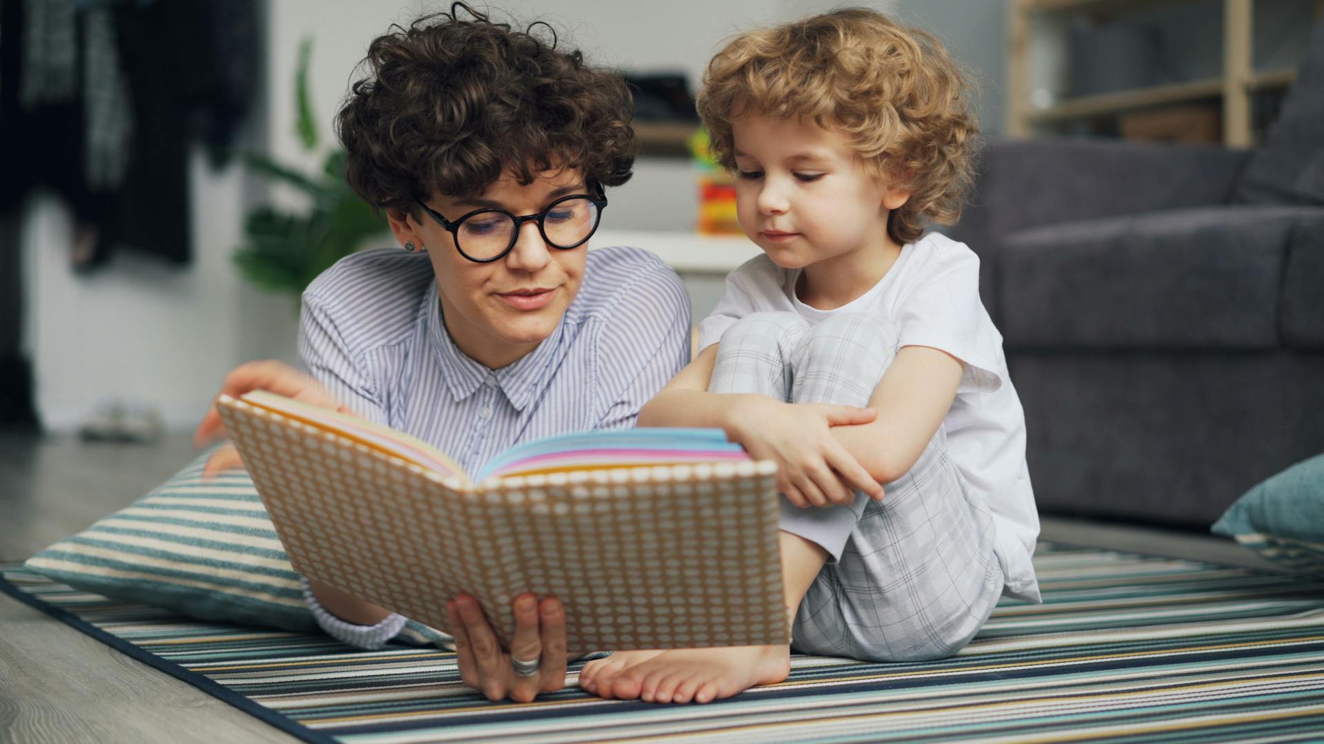 Basic Literacy Resources: Essential Tools for Effective Learning Literacy Resources,Reading LearningMole Literacy Resources: Mother and son lying down on carpet with book